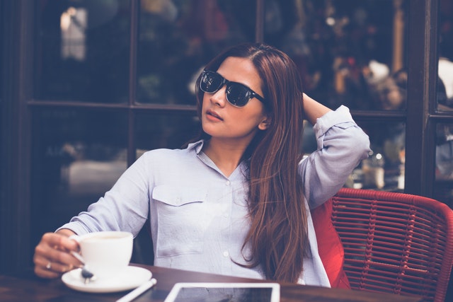 woman drinking coffee alone